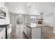 Modern kitchen with an island, stainless appliances, and a view of the backyard at 2248 Rosette Ln, Castle Rock, CO 80104