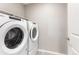 Laundry room with a large capacity washer and dryer has space to make doing laundry a breeze at 2248 Rosette Ln, Castle Rock, CO 80104