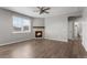 Cozy living room with a fireplace and plenty of natural light at 2248 Rosette Ln, Castle Rock, CO 80104