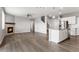 Open living space featuring a fireplace, wood-look flooring, and modern design at 2248 Rosette Ln, Castle Rock, CO 80104