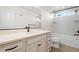 Bathroom with a single vanity, bathtub, and shower at 2388 W 165Th Pl, Broomfield, CO 80023