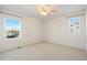 Simple bedroom with large windows and ceiling fan at 2388 W 165Th Pl, Broomfield, CO 80023