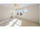 Spacious bedroom with ensuite bathroom access and a ceiling fan at 2388 W 165Th Pl, Broomfield, CO 80023