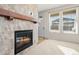 Gas fireplace with a stone surround in living room area at 2388 W 165Th Pl, Broomfield, CO 80023