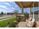 Covered porch with seating area, overlooking the street at 2388 W 165Th Pl, Broomfield, CO 80023