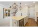 Modern kitchen features an island, stainless steel appliances, and access to deck at 2388 W 165Th Pl, Broomfield, CO 80023