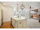 Modern kitchen with island, stainless steel appliances, and access to deck at 2388 W 165Th Pl, Broomfield, CO 80023