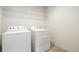 Laundry room with washer and dryer and shelving at 2388 W 165Th Pl, Broomfield, CO 80023