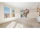 Bright and airy living room with neutral carpeting and natural light at 2388 W 165Th Pl, Broomfield, CO 80023