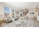 Spacious living room with a gray sofa and access to a deck at 2388 W 165Th Pl, Broomfield, CO 80023