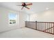 Bright loft area with ceiling fan and large windows offering natural light at 2388 W 165Th Pl, Broomfield, CO 80023