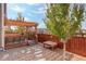 Relaxing patio area with pergola, seating, and gravel landscaping at 2388 W 165Th Pl, Broomfield, CO 80023
