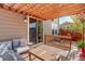 Pergola-covered patio features sliding door access and wooden seating at 2388 W 165Th Pl, Broomfield, CO 80023