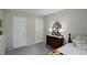 Bedroom features dresser, lamps, and ample room for storage and personal touches at 9642 Meade Ct, Westminster, CO 80031