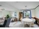 Open-concept layout with a dining area and living room with natural light at 9642 Meade Ct, Westminster, CO 80031