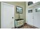 Bright entryway featuring tile floors, a decorative chest, and a view of the front door at 9642 Meade Ct, Westminster, CO 80031