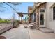 Beautiful patio with pergola, outdoor seating, and stunning views of the surrounding landscape at 10061 Bluffmont Ct, Lone Tree, CO 80124