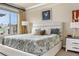 Inviting bedroom with a queen-sized bed, soft lighting, and a picturesque view from the window at 10061 Bluffmont Ct, Lone Tree, CO 80124