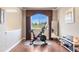 Bright exercise room with large window overlooking an expansive green landscape view at 10061 Bluffmont Ct, Lone Tree, CO 80124