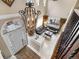 Grand foyer with a high ceiling, decorative chandelier, and clear view into a spacious living area with large windows at 10061 Bluffmont Ct, Lone Tree, CO 80124
