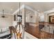 Spacious hallway on the second floor offering views of downstairs and a decorative chandelier at 10061 Bluffmont Ct, Lone Tree, CO 80124