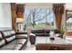 Inviting living room features large windows, comfortable seating, and elegant decor at 10061 Bluffmont Ct, Lone Tree, CO 80124