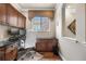 An office featuring custom built-in cabinetry, a window, and desk space, perfect for work at 10061 Bluffmont Ct, Lone Tree, CO 80124
