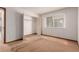 Bedroom features a closet with natural light from the window at 9824 Lane St, Thornton, CO 80260