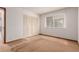 Bright bedroom features a closet and a window offering plenty of natural light at 9824 Lane St, Thornton, CO 80260