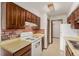 Traditional kitchen with updated appliances and cabinetry at 9824 Lane St, Thornton, CO 80260