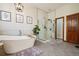 Luxurious bathroom with a freestanding tub, glass-enclosed shower, sleek fixtures, and modern design elements at 10441 Carriage Club Dr, Lone Tree, CO 80124