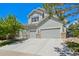 Charming two-story home with a three car garage, beautiful stone accents, and mature landscaping at 10441 Carriage Club Dr, Lone Tree, CO 80124