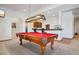 Spacious game room with a pool table, wet bar, and Colorado-themed light fixture above the billiards table at 10441 Carriage Club Dr, Lone Tree, CO 80124