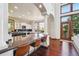 Open concept kitchen with granite countertop island, breakfast bar, and natural light at 10441 Carriage Club Dr, Lone Tree, CO 80124