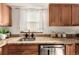 Granite countertop kitchen with wood cabinets at 2028 Perry St, Denver, CO 80212