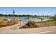 Peaceful lakefront walkway with nearby boats and flowers at 2028 Perry St, Denver, CO 80212