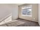 Neutral bedroom featuring a large window providing ample natural light at 4406 Sidewinder Loop, Castle Rock, CO 80108
