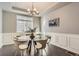 Elegant dining room featuring a modern chandelier and stylish decor at 4406 Sidewinder Loop, Castle Rock, CO 80108