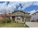 Inviting two-story home with a well-manicured lawn and inviting entrance at 4406 Sidewinder Loop, Castle Rock, CO 80108