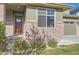 Charming exterior displaying brick accents, neutral siding, and manicured landscaping at 4406 Sidewinder Loop, Castle Rock, CO 80108