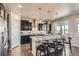 Spacious kitchen with granite countertops, stainless steel appliances, and a center island with bar seating at 4406 Sidewinder Loop, Castle Rock, CO 80108