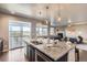 Well-lit kitchen with stainless steel appliances and granite countertops at 4406 Sidewinder Loop, Castle Rock, CO 80108