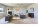 Bright living room featuring a fireplace, neutral color palette, and comfortable seating arrangement at 4406 Sidewinder Loop, Castle Rock, CO 80108