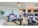 Spacious living room showcases open layout, stylish furnishings, and seamless flow to kitchen at 4406 Sidewinder Loop, Castle Rock, CO 80108
