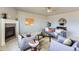 Cozy living room with a fireplace and comfortable seating at 4406 Sidewinder Loop, Castle Rock, CO 80108