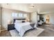Relaxing main bedroom featuring a plush bed and decorative accents, bathed in natural light at 4406 Sidewinder Loop, Castle Rock, CO 80108