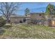 View of the house backyard with a grill and patio set at 12995 W Chenango Ave, Morrison, CO 80465