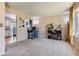 Cozy living room showing comfortable carpeting, a decorative fireplace, and an adjacent room at 12995 W Chenango Ave, Morrison, CO 80465