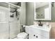 Bathroom featuring a walk-in shower, vanity with mirror and modern fixtures, and neutral paint at 12908 Hudson St, Thornton, CO 80241