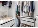 Walk-in closet with custom shelving, drawers, and ample storage at 12908 Hudson St, Thornton, CO 80241